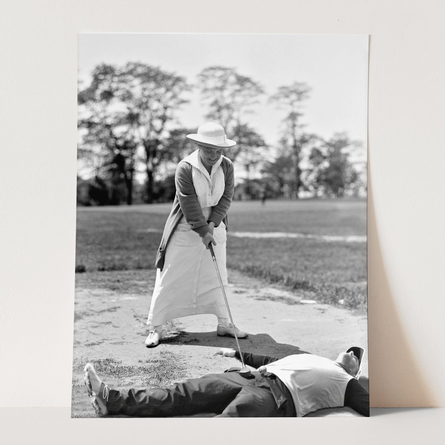 Woman Golfing On Top Of Man