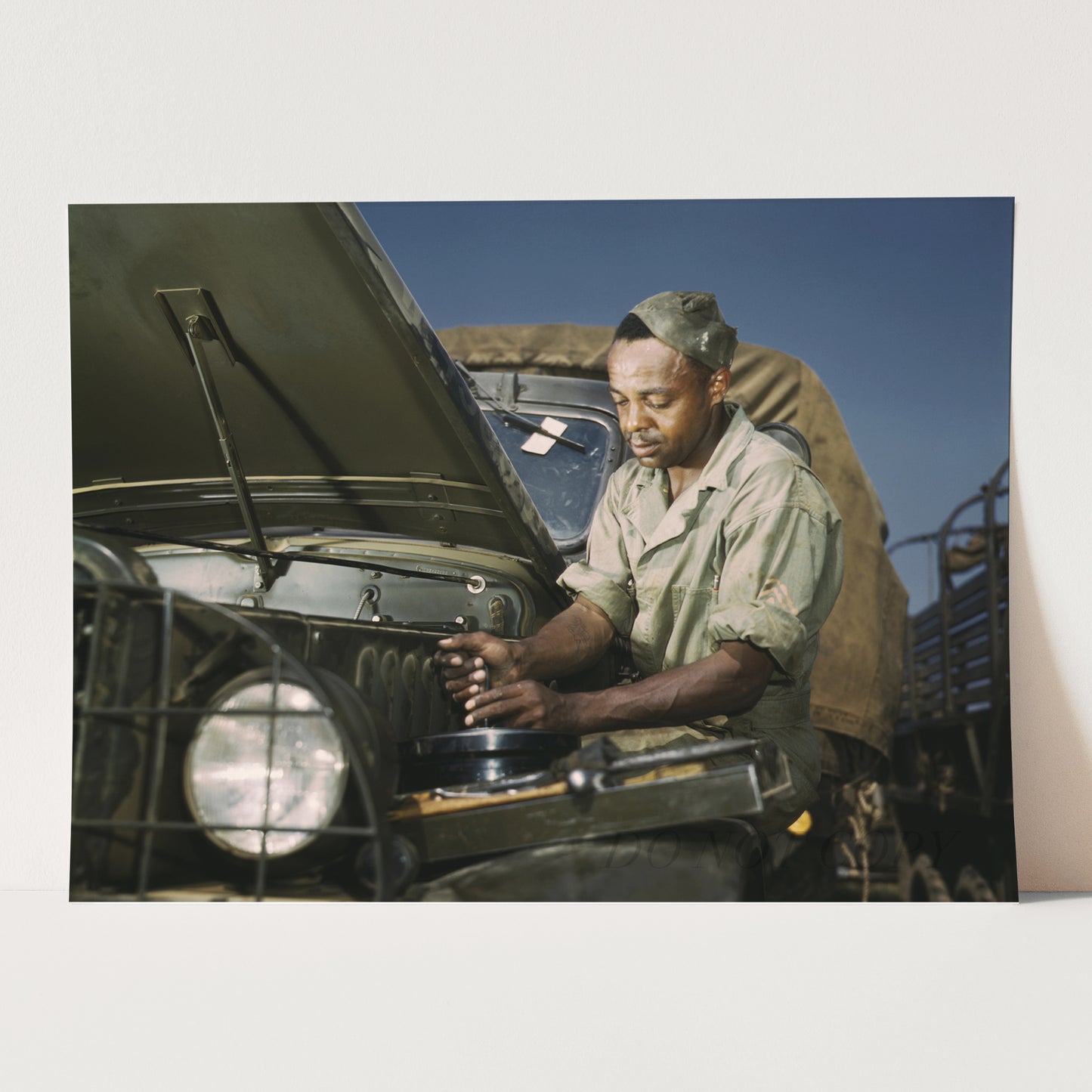 African American Mechanic Servicing a Jeep, World War Two