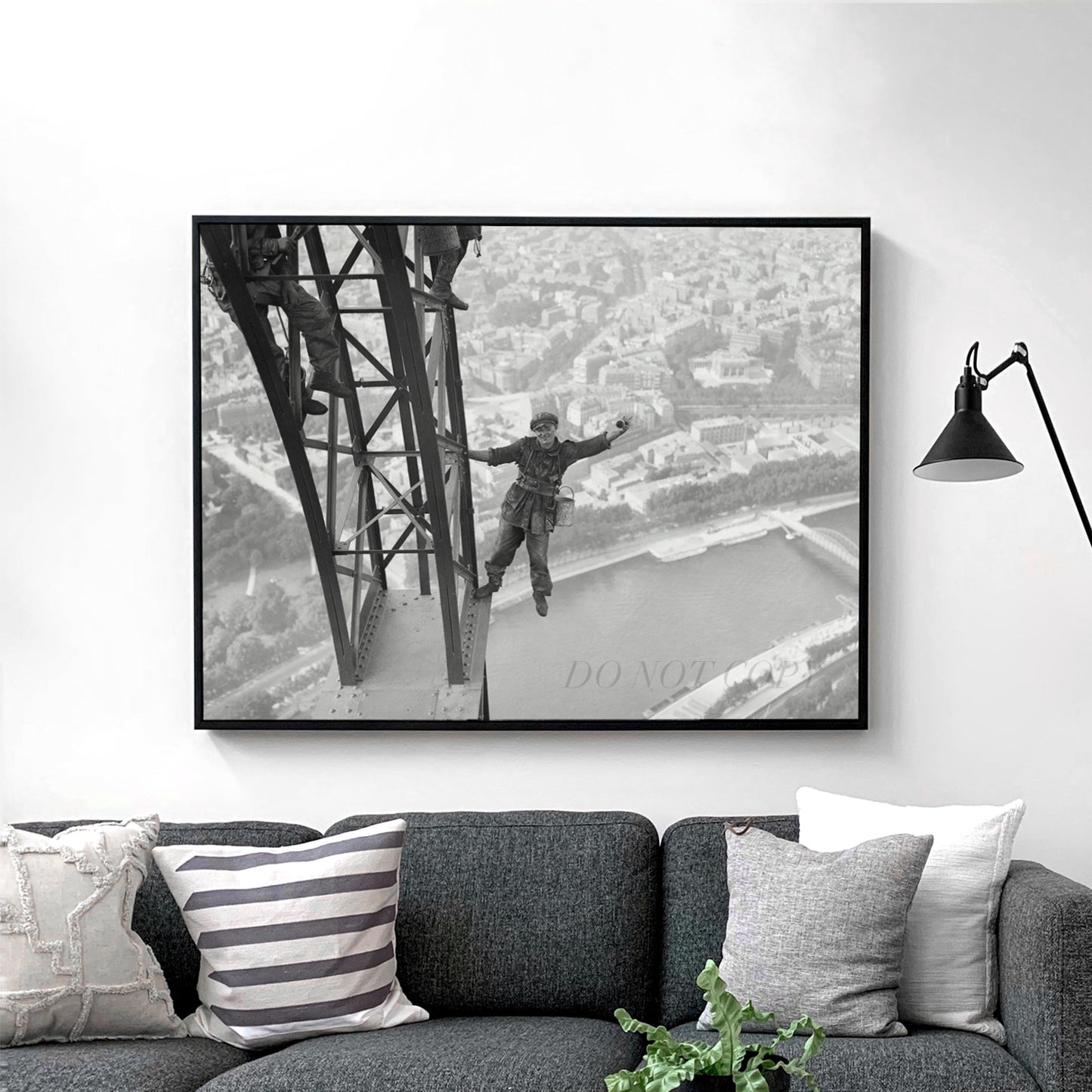 Worker Finishes Painting the Eiffel Tower