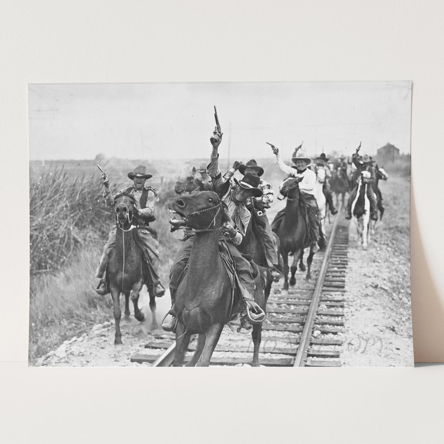 Cowboys Shooting Guns On Horseback