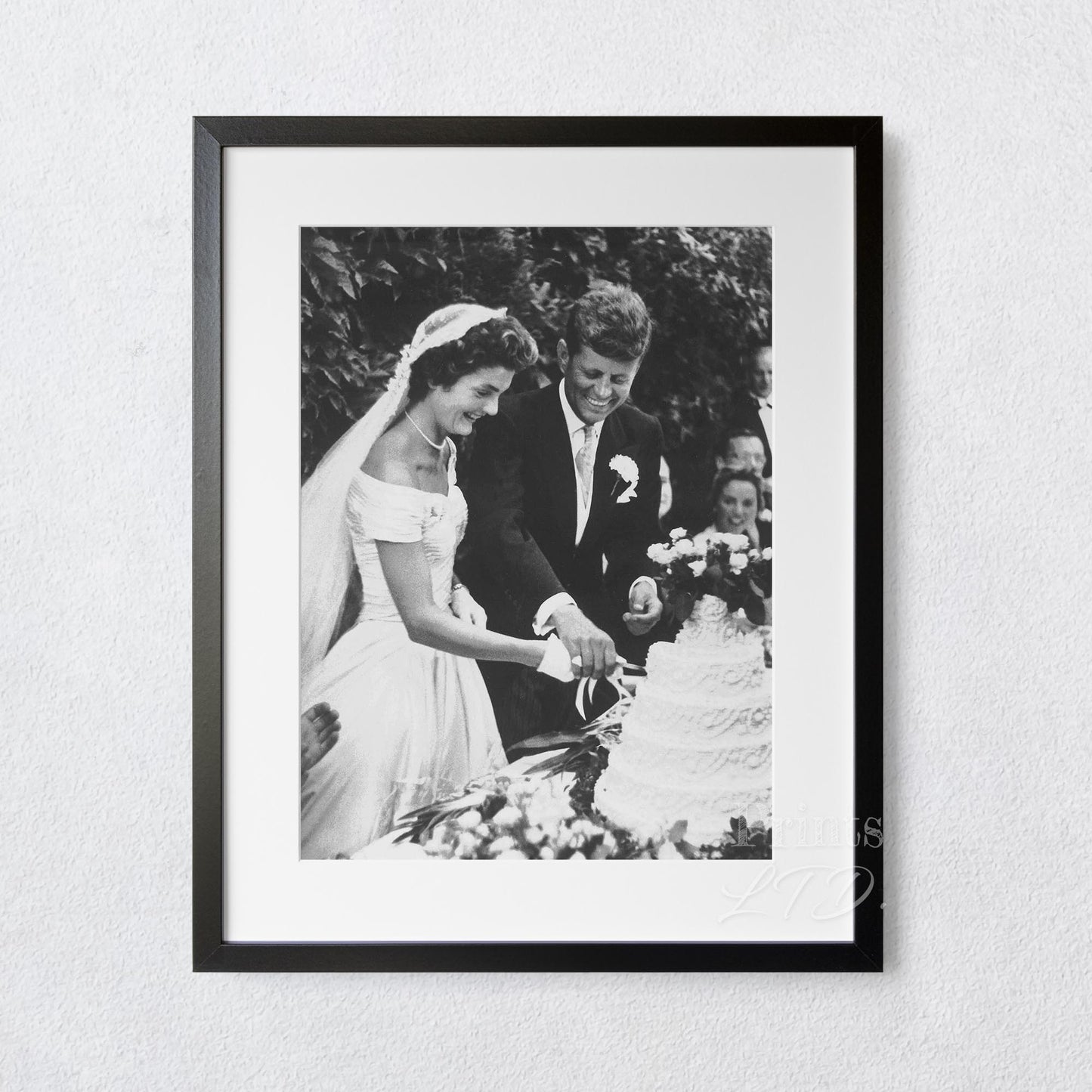John F Kennedy (JFK) and Jackie Kennedy cutting cake at their wedding