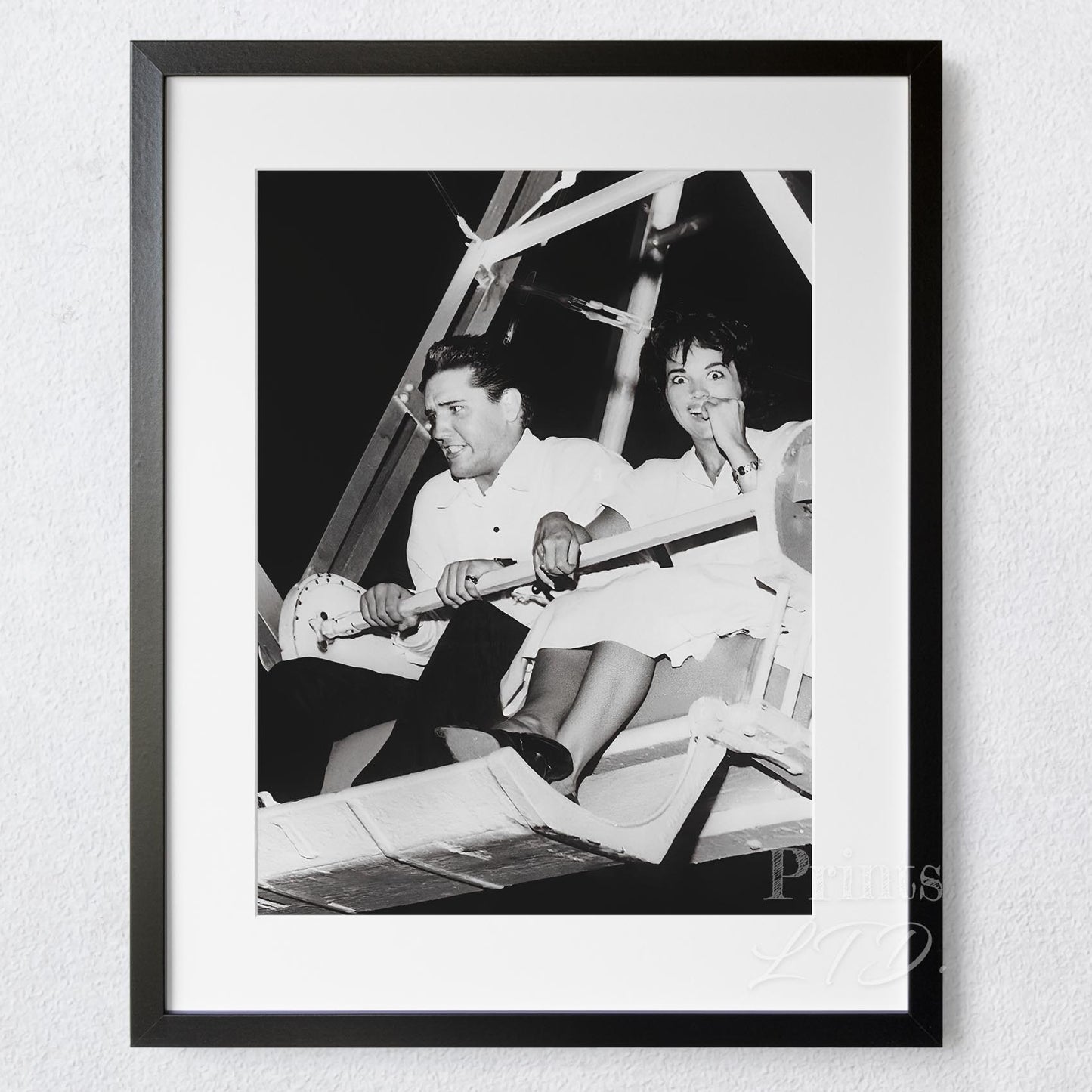 Elvis and Anita Wood riding a roller coaster, 1957