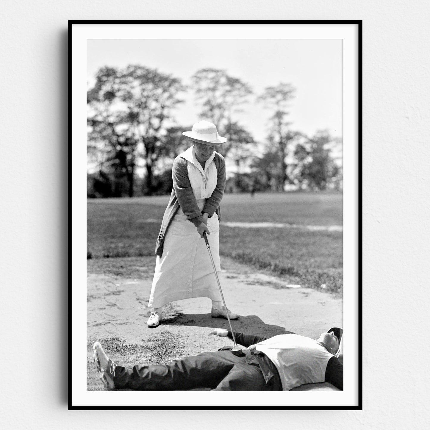 Woman Golfing On Top Of Man