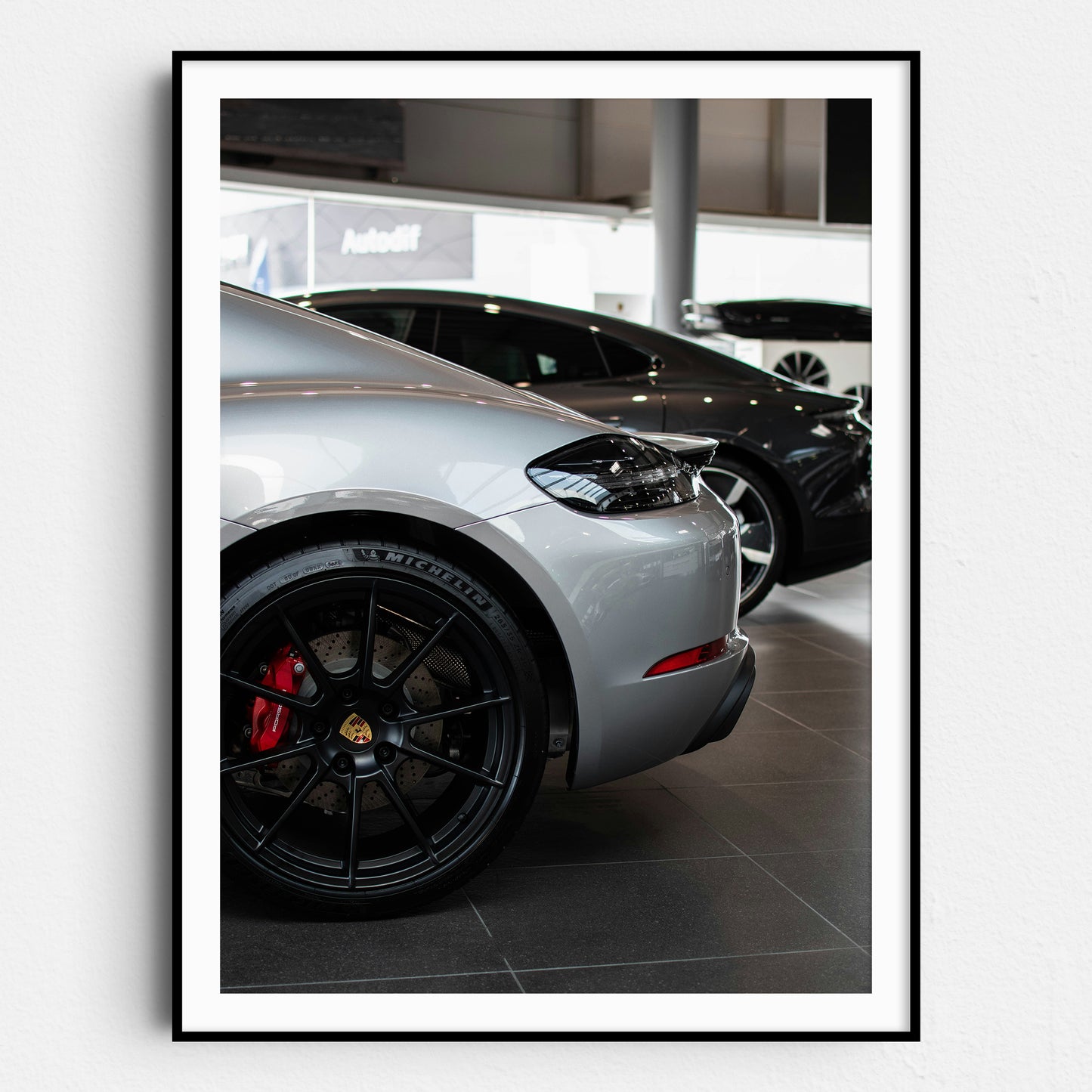 Silver Porsche in the Showroom