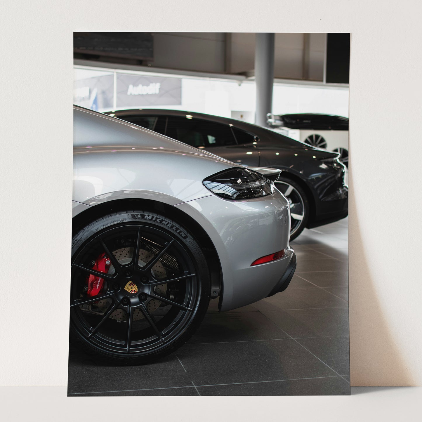 Silver Porsche in the Showroom