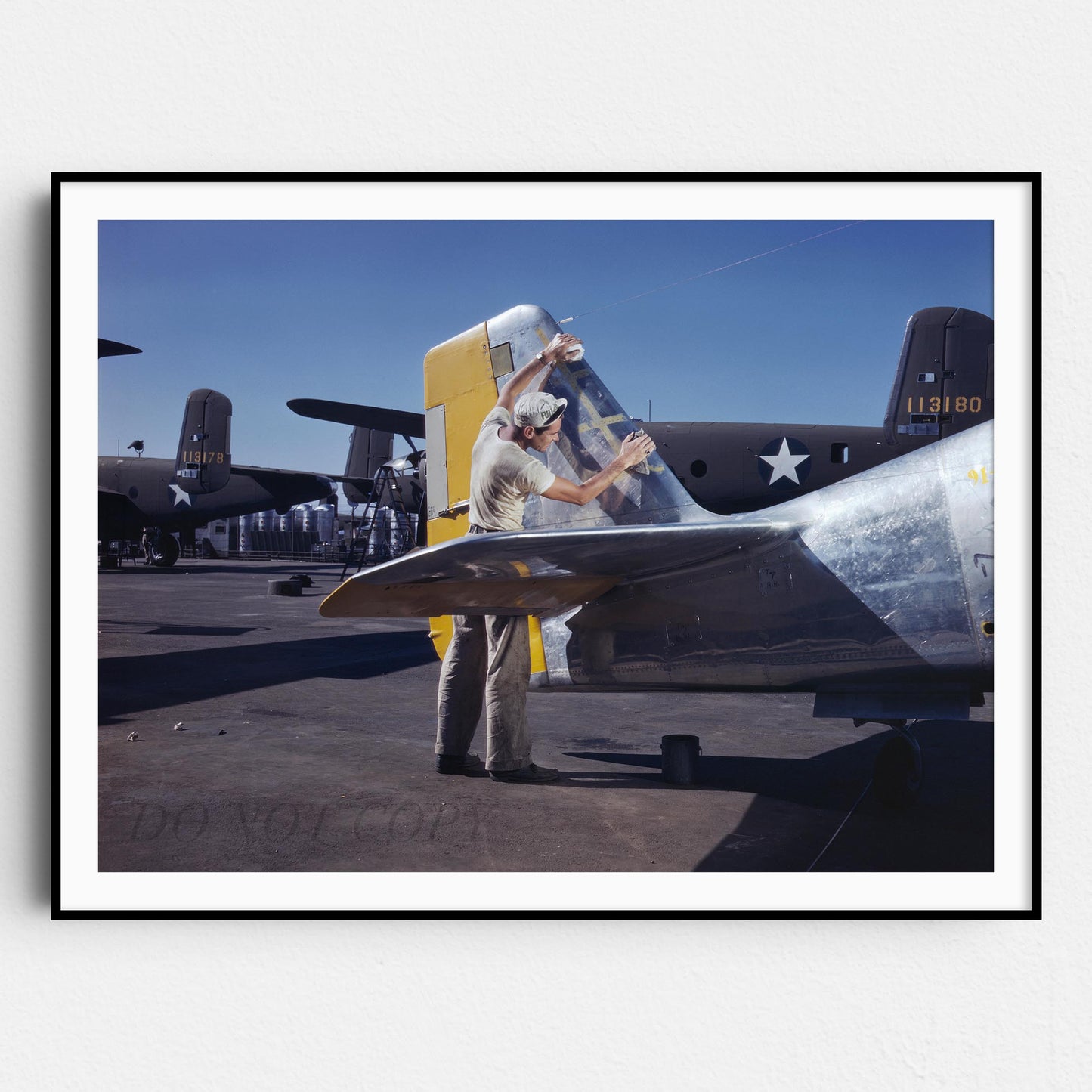 Cleaning the Tail of a P51 Fighter Plane, World War Two
