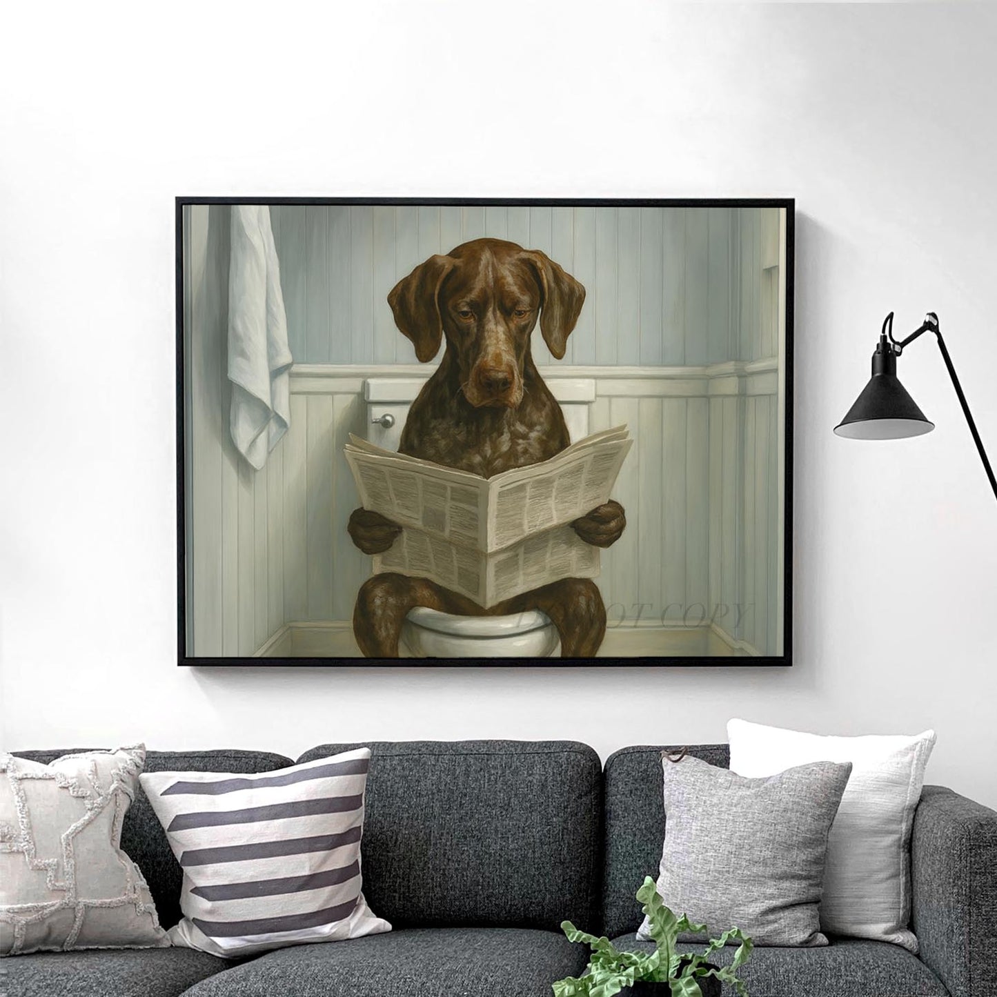 German Shorthaired Pointer Dog Reading The Newspaper On The Toilet