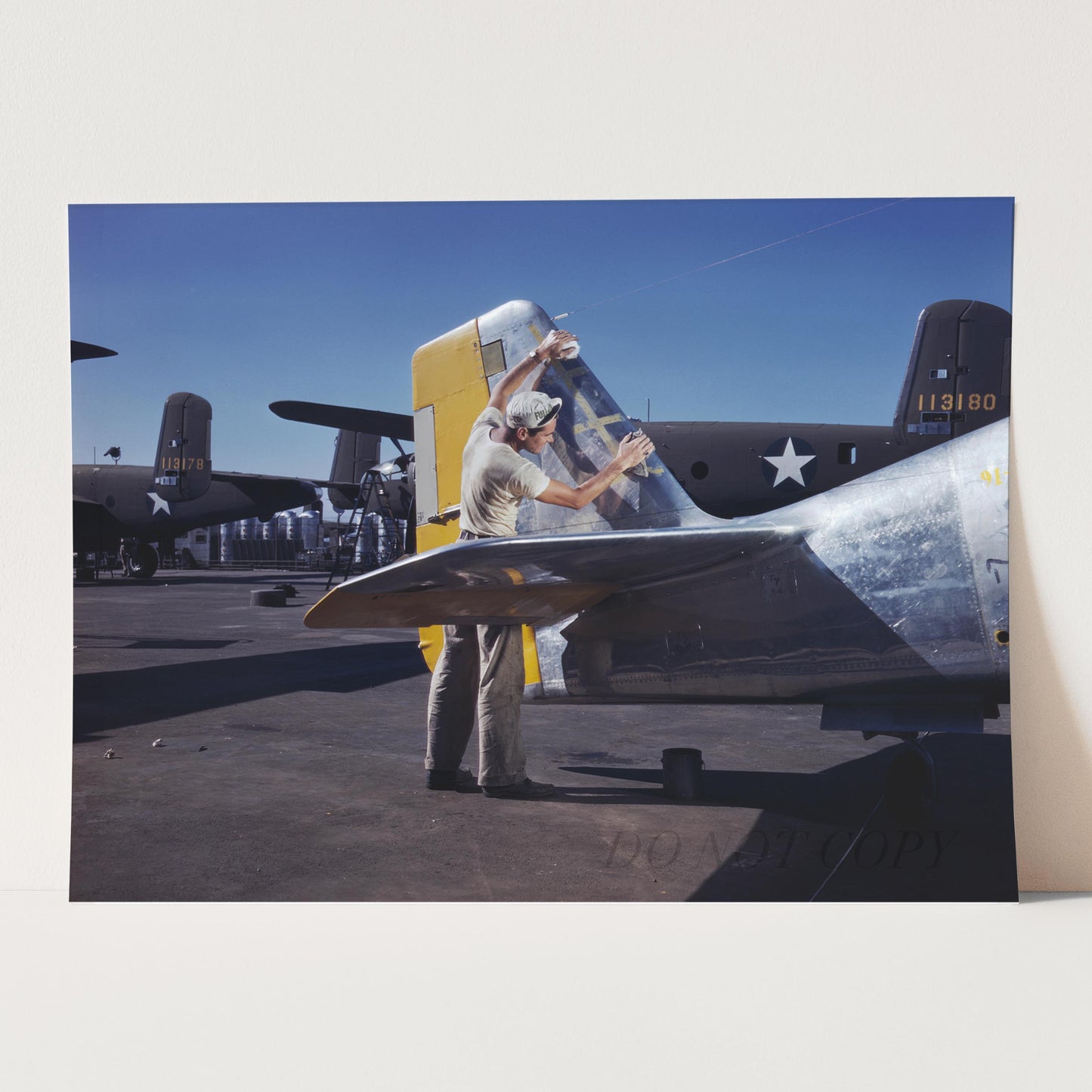 Cleaning the Tail of a P51 Fighter Plane, World War Two