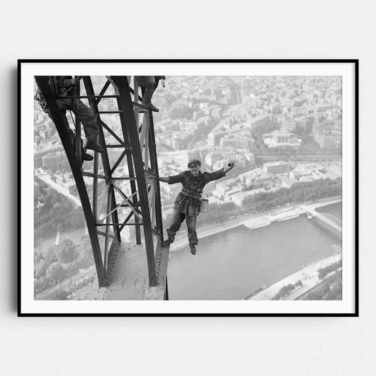 Worker Finishes Painting the Eiffel Tower