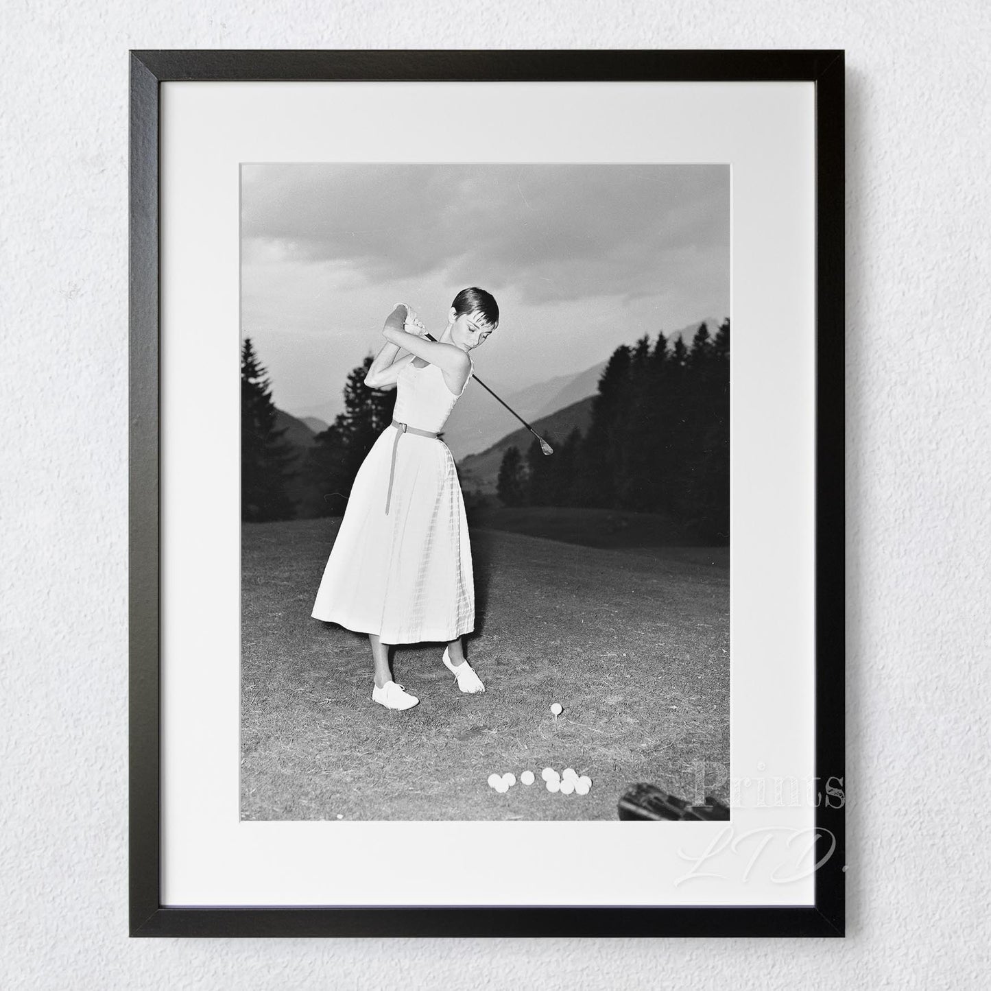 Audrey Hepburn playing golf