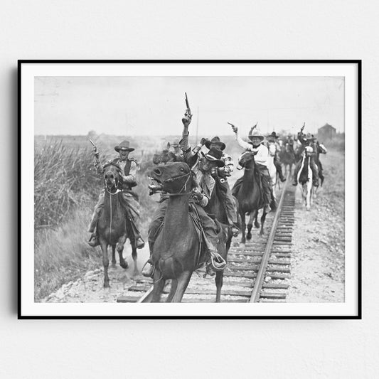 Cowboys Shooting Guns On Horseback