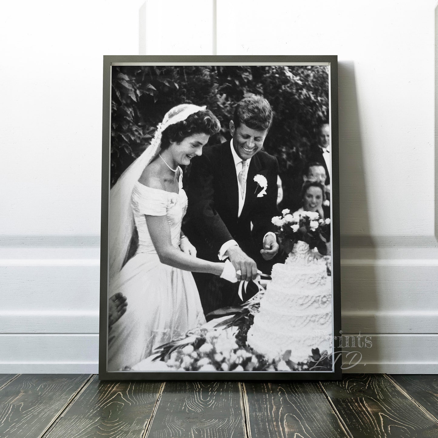 John F Kennedy (JFK) and Jackie Kennedy cutting cake at their wedding